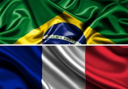 Half Brazilian flag next to half French flag